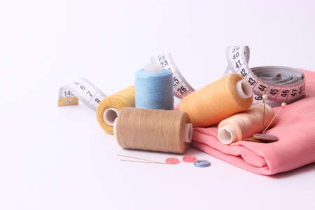 Set of different sewing accessories on a white background close-upの写真素材