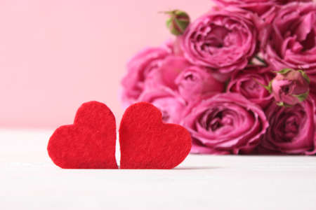 gift and flowers on a colored background. Holiday, give a gift, congratulationsの写真素材