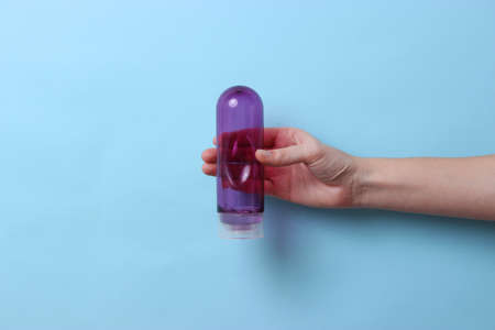 An intimate lubricant for comfortable sex close-up on a colored background.の写真素材