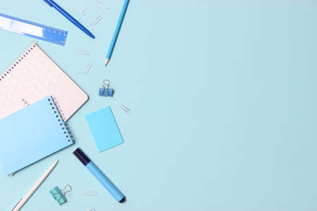 School office on a colored background top view. Office office, student office. Concept back to school. place for text. Flatlay. High quality photoの写真素材
