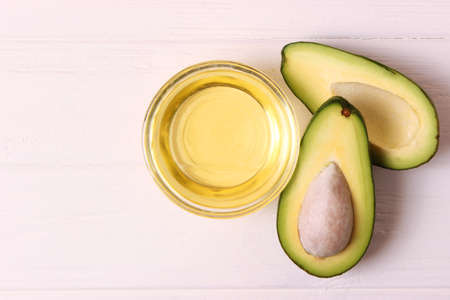 Avocado and avocado oil close up on the table. High quality photo