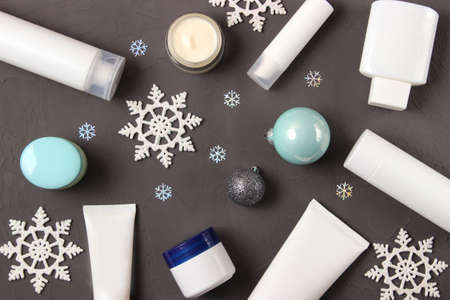Winter care cosmetics on a colored background top view.の写真素材