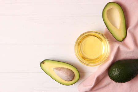 Avocado and avocado oil close up on the table