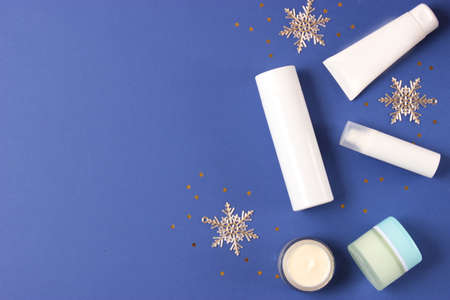 Winter care cosmetics on a colored background top view.の写真素材