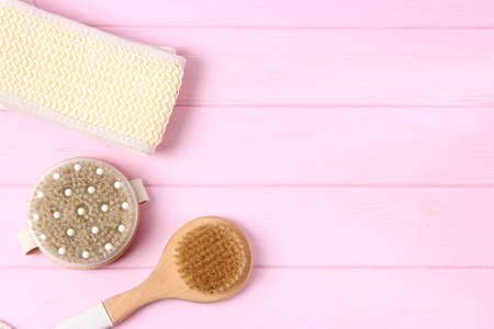 brush for dry massage on a colored background top view.