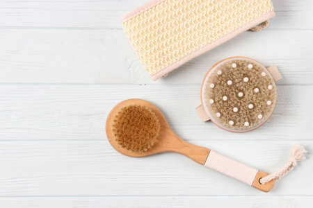 brush for dry massage on a colored background top view.