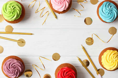 Delicious cupcake with a candle on a colored background with space for text.の写真素材