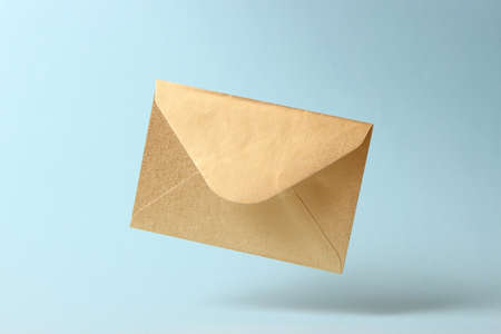 The envelope falls to the ground on a colored background.の写真素材