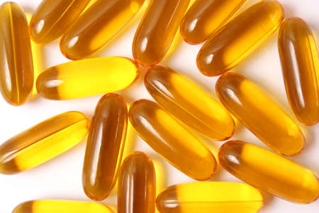Omega-3 capsules on a white background. Fish oil, healthy supplementsの写真素材