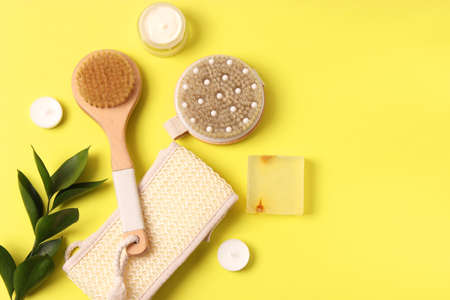 brush for dry massage on a colored background top view.