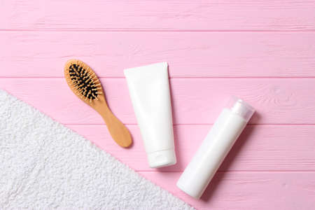 hair products and comb on a colored background close upの写真素材