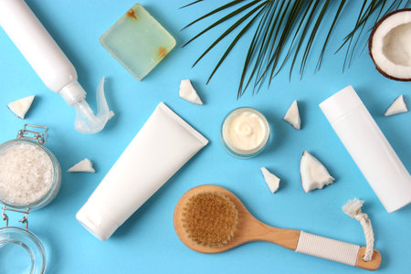 Cosmetic jars and coconut on the table close-up and place for text.の写真素材