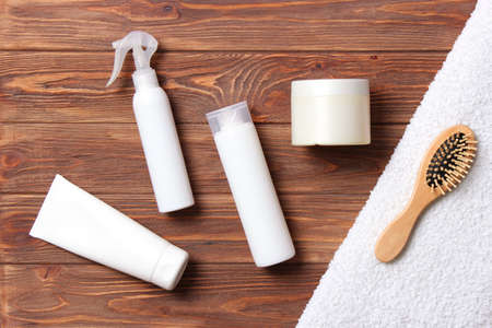 hair products and comb on a colored background close upの写真素材