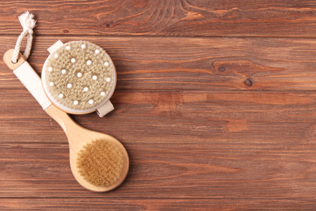brush for dry massage on a colored background top view.