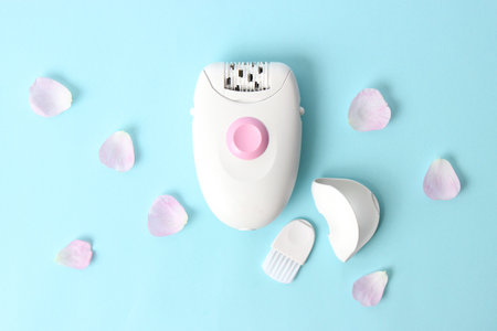 Modern mechanical epilator on a colored background close-up.の写真素材