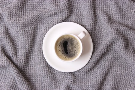 Cup of coffee with froth close up with place for textの写真素材