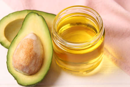 Avocado and avocado oil close up on the table