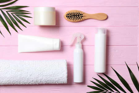 hair products and comb on a colored background close upの写真素材