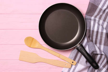 frying pan and on the wooden table top view. Cooking.の写真素材
