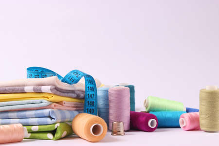 sewing accessories close-up. hobbies, fabrics and threads for sewingの写真素材