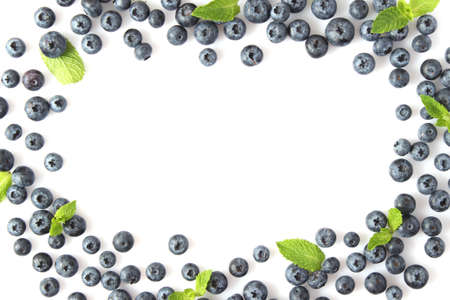 blueberry and mint leaves on a white background top view. Place for textの写真素材