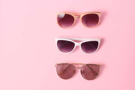 set of sunglasses on a colored background top view.の写真素材