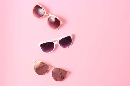 set of sunglasses on a colored background top view.の写真素材