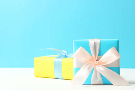 gifts on a colored background top view. Holiday, giving presents, birthday.
