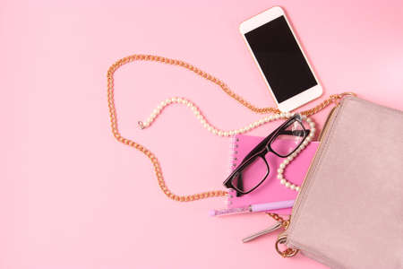 womens bag and cosmetics on a colored backgroundの写真素材