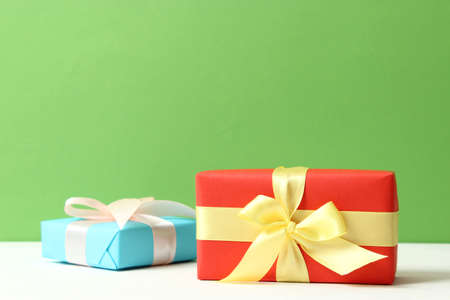 gifts on a colored background top view. Holiday, giving presents, birthday.