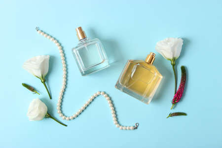 perfume and flowers on a colored background.の写真素材
