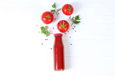 Ketchup on the table. Tomato sauce, fresh tomatoes.の写真素材
