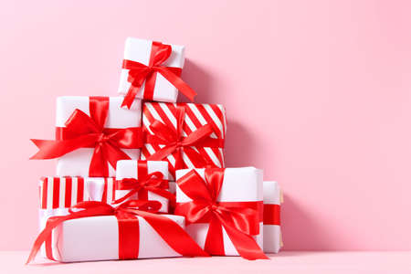 Set of beautifully wrapped gift boxes on a colored background top view.の写真素材