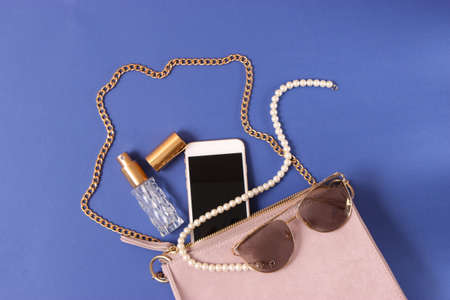 womens bag and cosmetics on a colored backgroundの写真素材