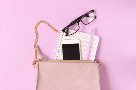 womens bag and cosmetics on a colored backgroundの写真素材