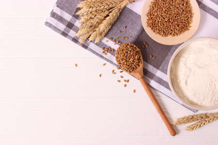 spikelets of wheat on a colored background top view.の写真素材