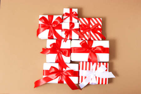 Set of beautifully wrapped gift boxes on a colored background top view.の写真素材