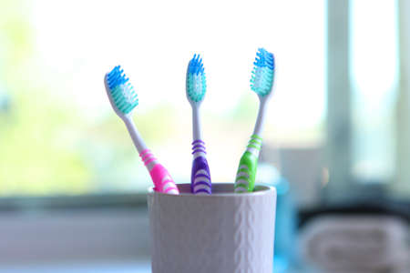 Toothbrushes and oral cleaners on the table.の写真素材