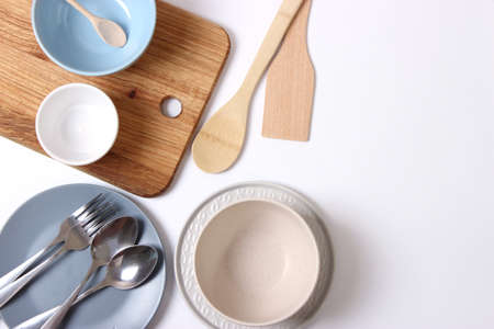 Set of dishes and kitchen utensils top view.