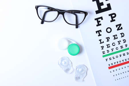 table for checking vision, glasses and lenses for correcting visionの写真素材