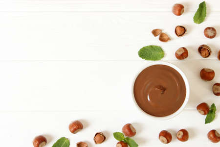 chocolate paste in a glass jar on a colored background.の写真素材