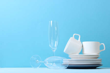 A set of dishes and kitchen utensils on a colored background.の写真素材