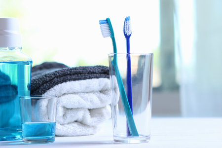 Toothbrushes and oral cleaners on the table.