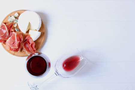 red wine and snacks on the table top view.の写真素材