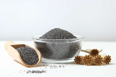 poppy seeds in a bowl on a tableの写真素材