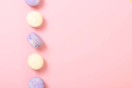 macaroons on a colored background top view.の写真素材