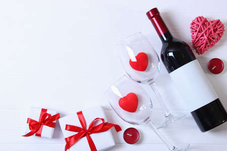 red wine and roses on the table. Valentines day background.の写真素材