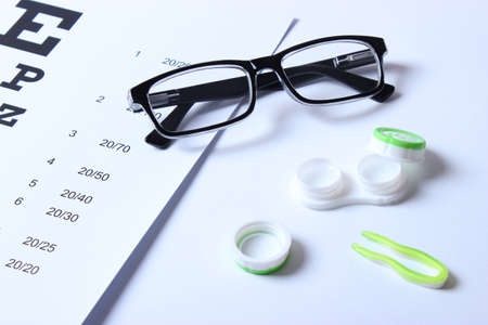 table for checking vision, glasses and lenses for correcting visionの写真素材