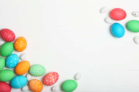 Easter eggs and flowers on the table top view.の写真素材