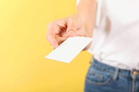 Business card in a female handの写真素材